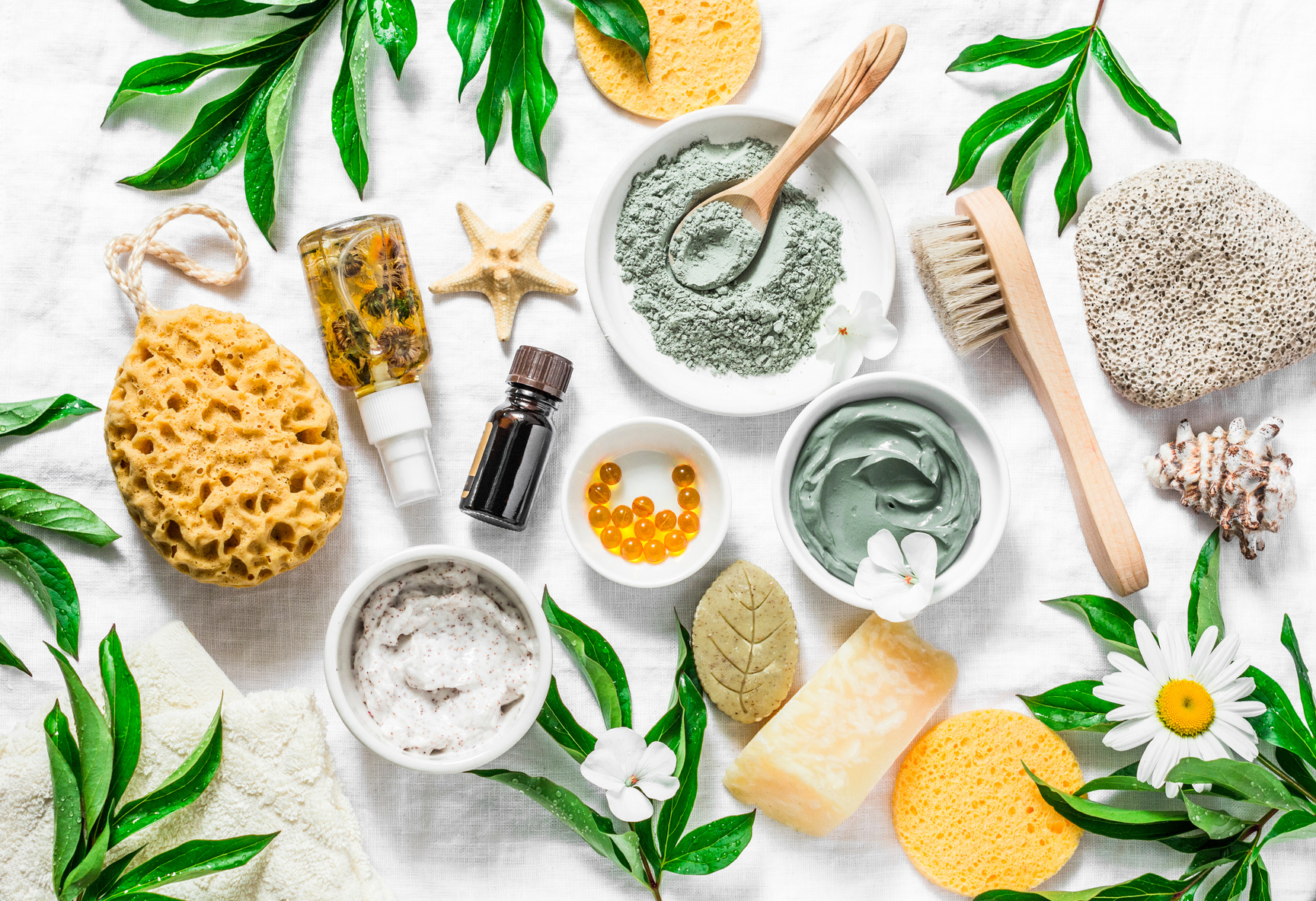 Flat lay beauty skin care ingredients, accessories. Natural beauty products on a light background, top view